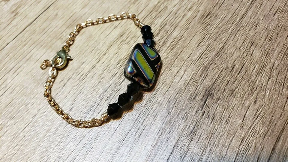 Hand Crafted, Painted Black Millefiori Glass & Gold Tone Chain Bracelet. Adjustable to 8.5" with Lobster Claw Clasp