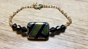 Hand Crafted, Painted Black Millefiori Glass & Gold Tone Chain Bracelet. Adjustable to 8.5" with Lobster Claw Clasp